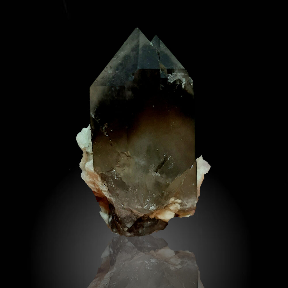 Smoky quartz on albite